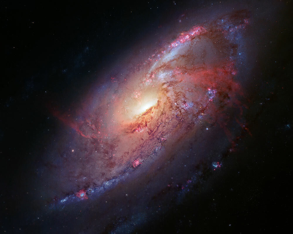 The spiral galaxy NGC 4258, imaged by the Hubble Space Telescope, measures 30,000 light-years across and lies 23 million light-years from Earth—and new measurements of some of the stars within suggest the universe is expanding faster than it should be.