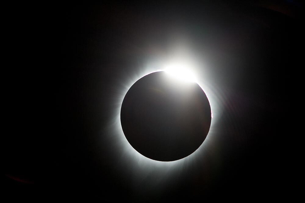 A solar eclipse at 99% totality, when it produces a diamond-ring effect