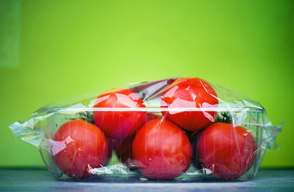 tomatoes wrapped in plastic wrap