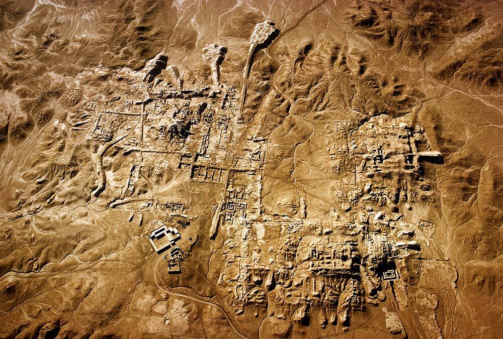 Photographed in 1973, ruins of this society's first city-state after thousands of years beneath the desert sands.