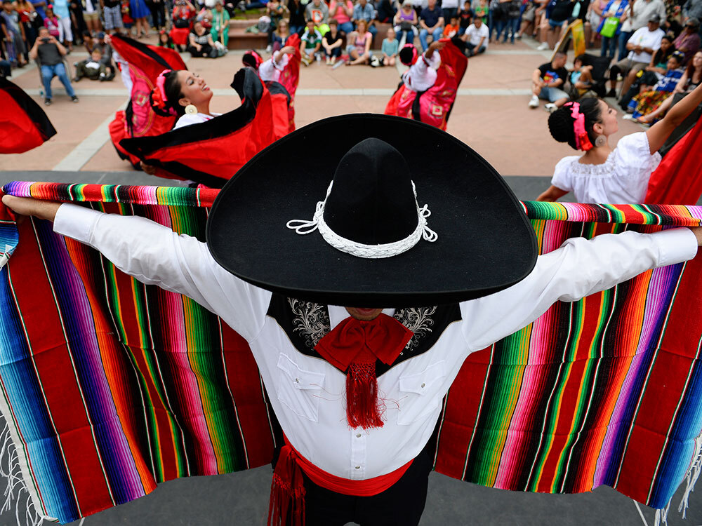 a dance troup performs a traditional dance during Cinco de Mayo