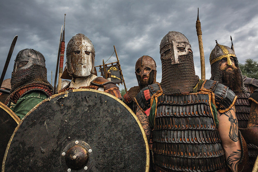 Sheathed in iron and leather, Viking reenactors wear their grim game faces.