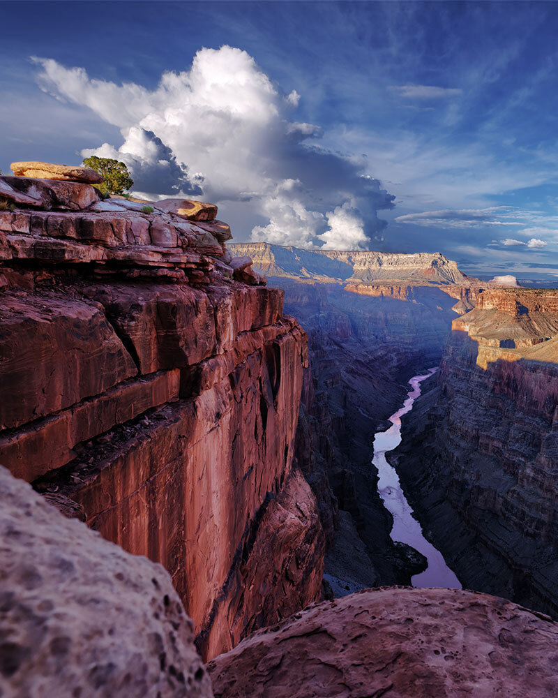 A picture of the Colorado River winding through a canyon 3,000 feet below.