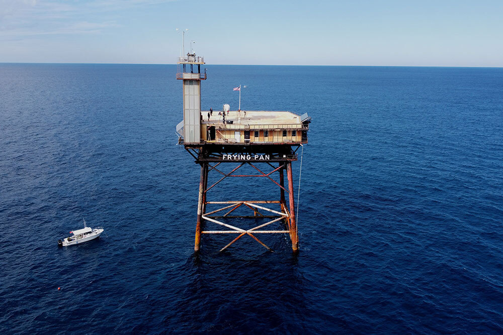 A picture of a structure built over a large body of water