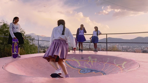 A gif of a girl skateboarding