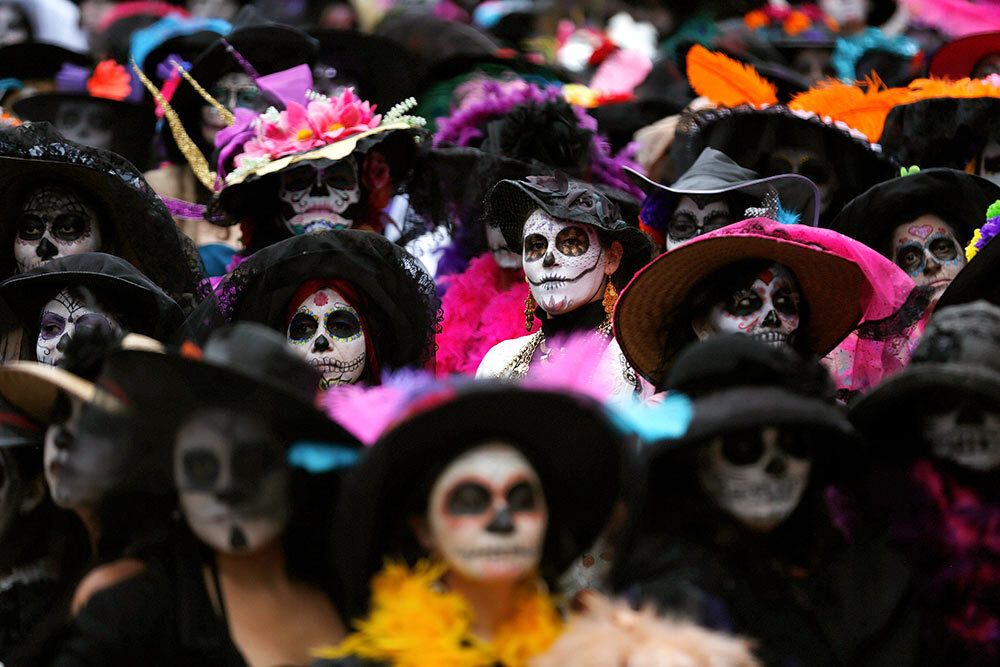 Revelers in Mexico City celebrate the Day of the Dead by dressing up as the holiday's most ubiquitous symbol, a skeletal figure known as the calavera Catrina.