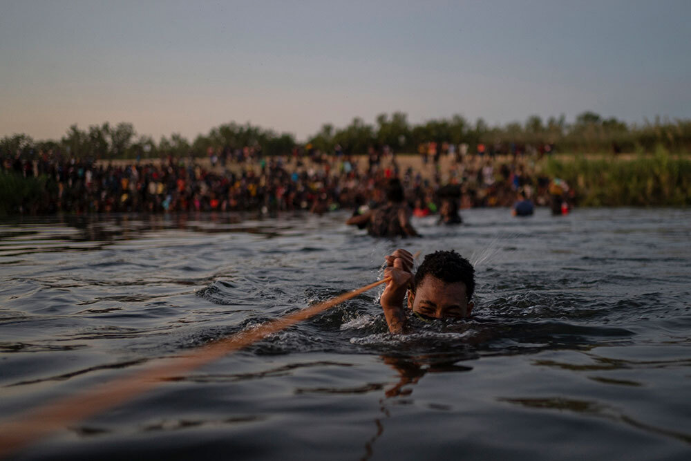 a person swims across the Rio Grande