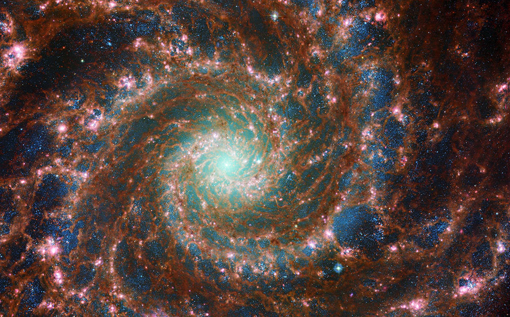 A picture of a spiraling red galaxy