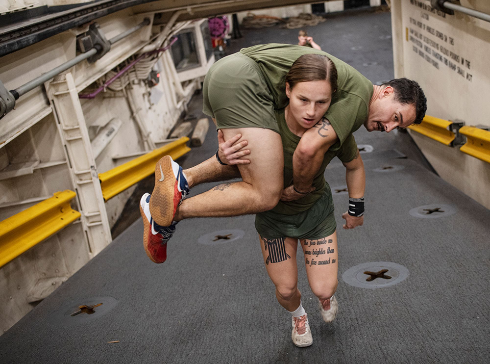 A United States Marine Corps recruit trains at Camp Lejeune as her unit readies for deployment.