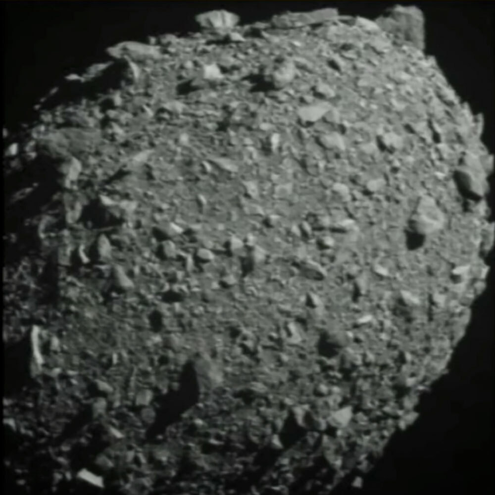 A grey image of a rocky sphere