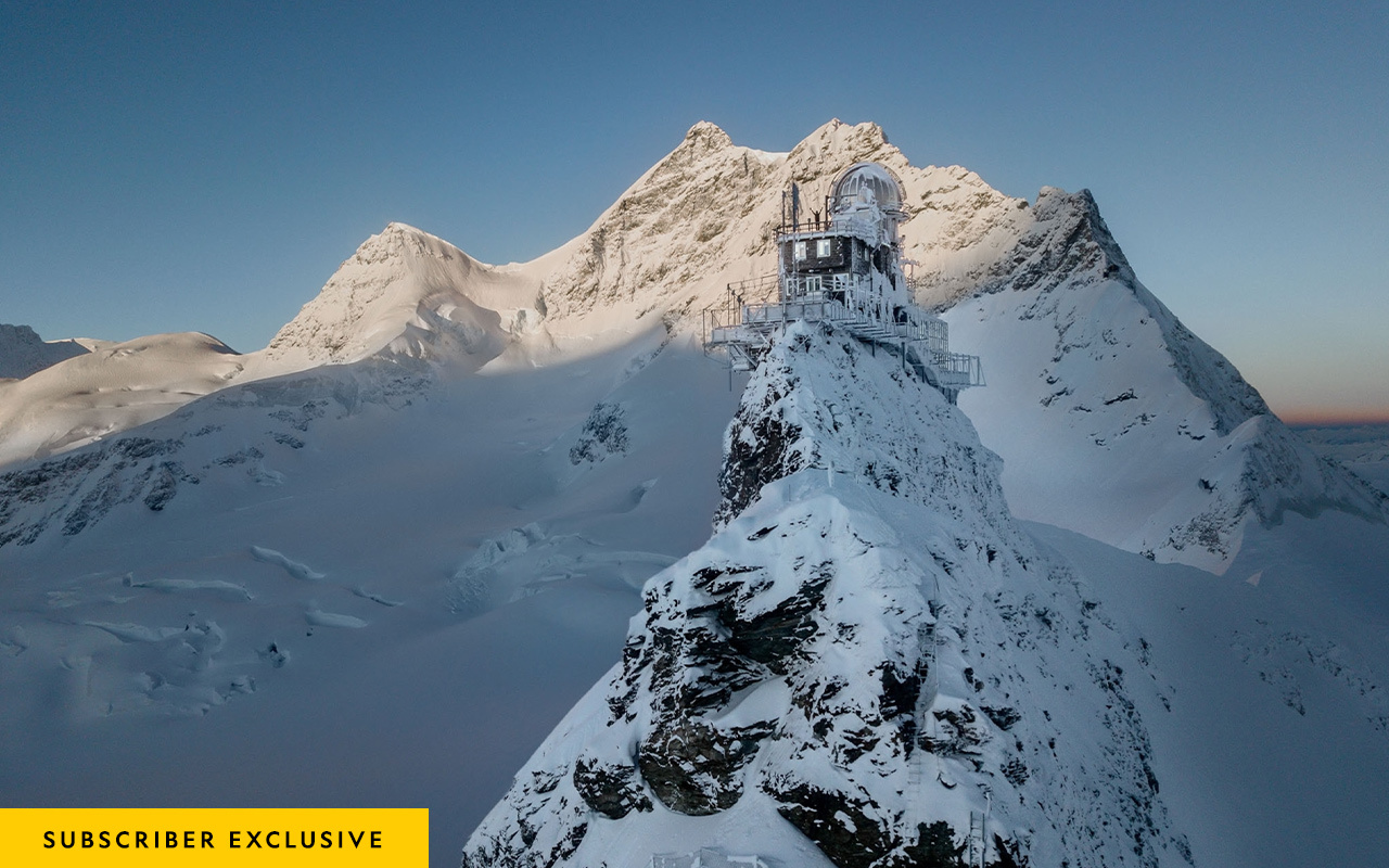 The Jungfraujoch research station looks rugged and isolated—and it is—but beneath its windswept stones lie an ice palace, a chocolate shop, and the highest train station in Europe.