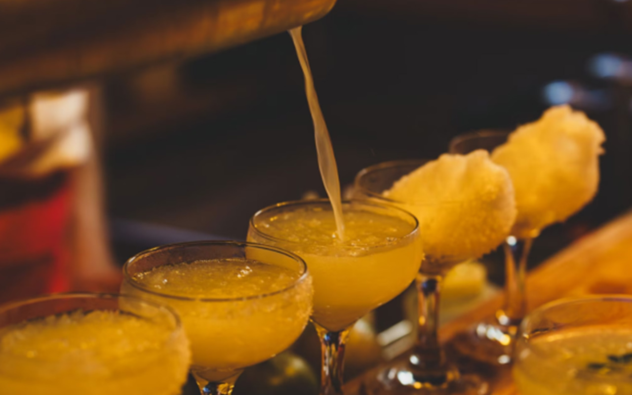 Bartender pouring margaritas