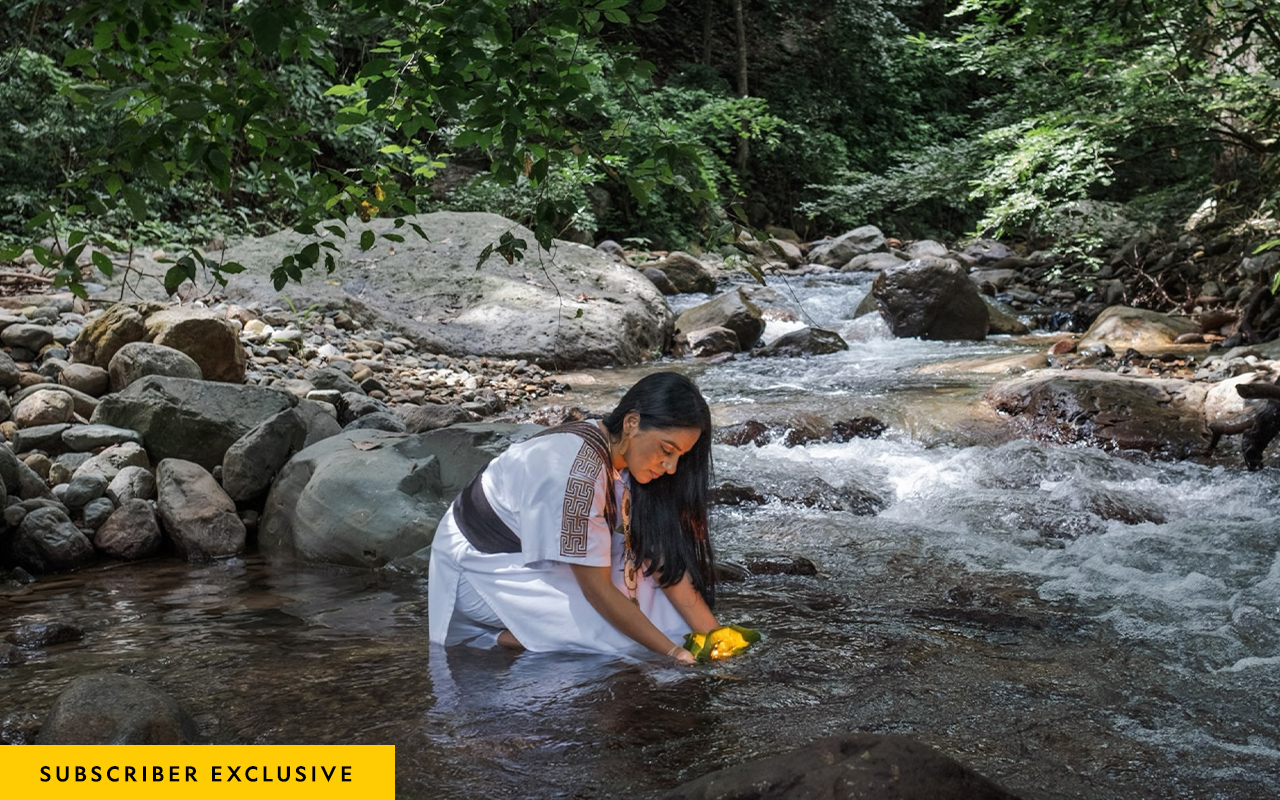 Ati Quigua performs a ritual to protect a river in the Sierra Nevada de Santa Marta mountains in northern Colombia’s Cesar Department.