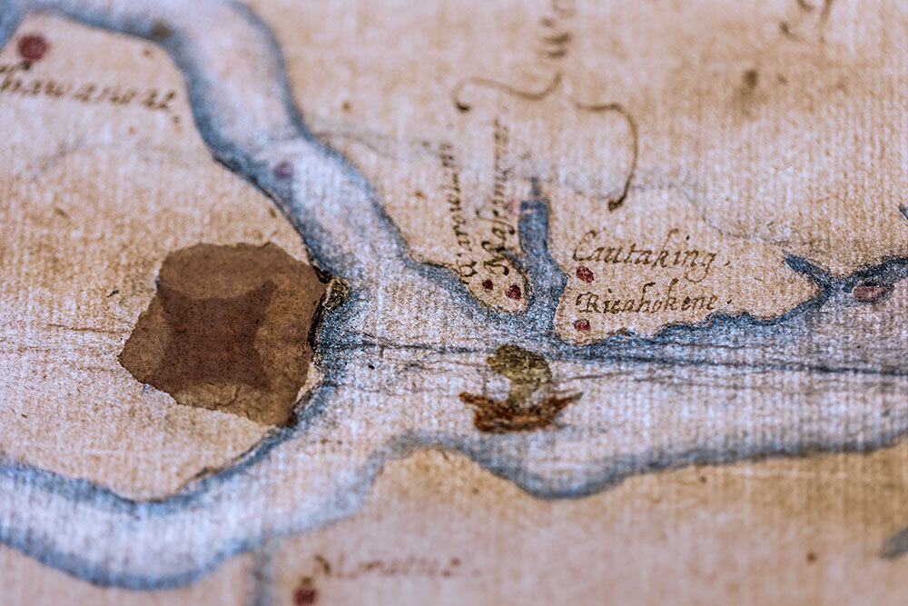 a detail of a map with a star-shaped symbol under a patch