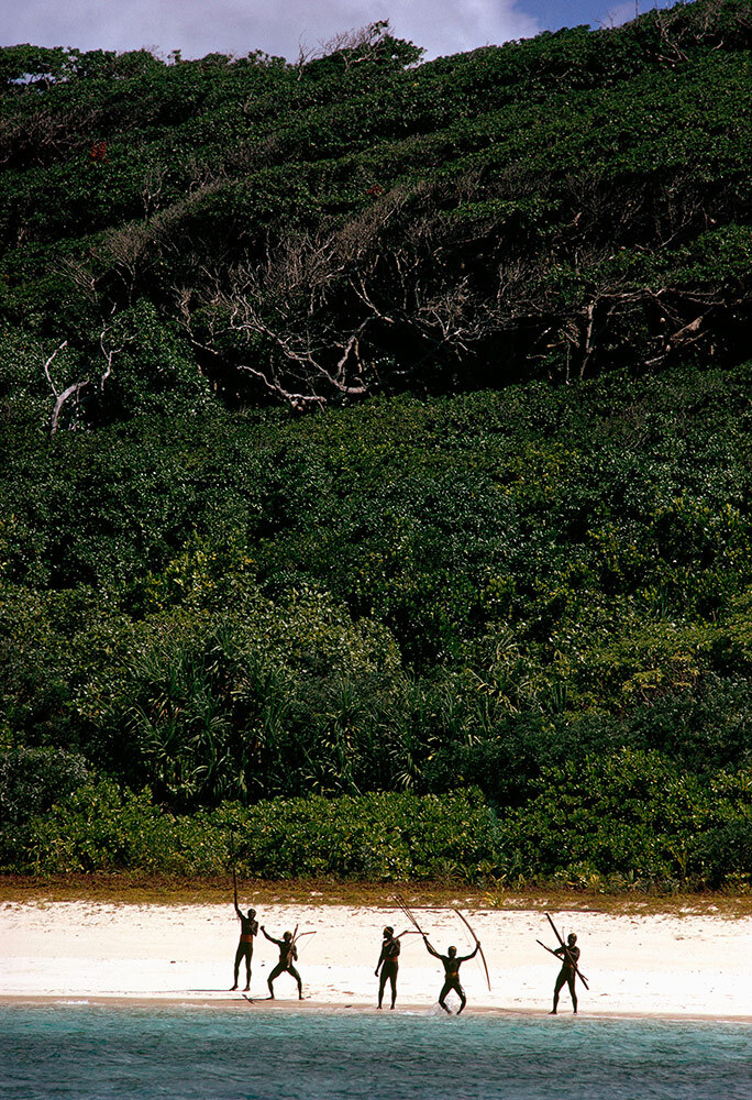 Warriors prancing with bows and arrows along the island's beaches are a testament to the tribe's defiance of the outside world. This photograph was first published in the July 1975 issue of National Geographic.