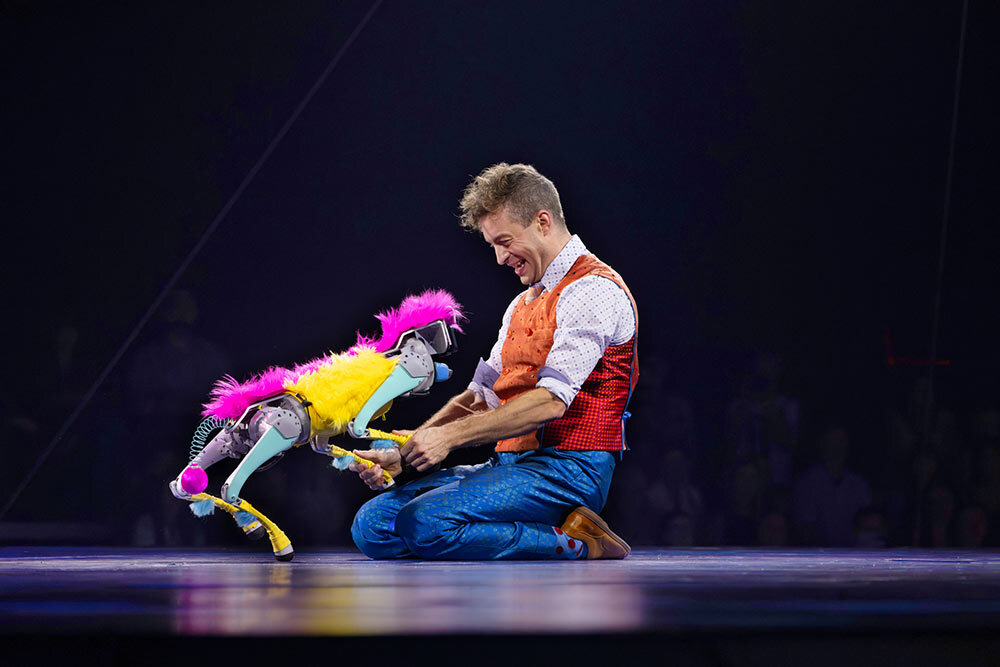 This performer interacts with a robot in place of a traditional animal