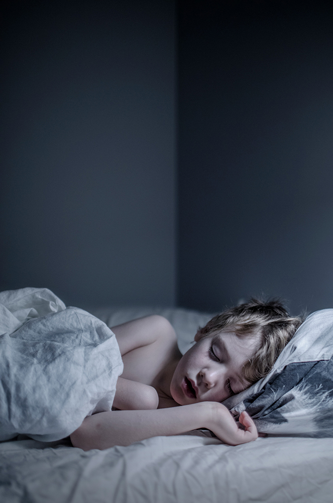 A boy sleeping with the light on in Sweden