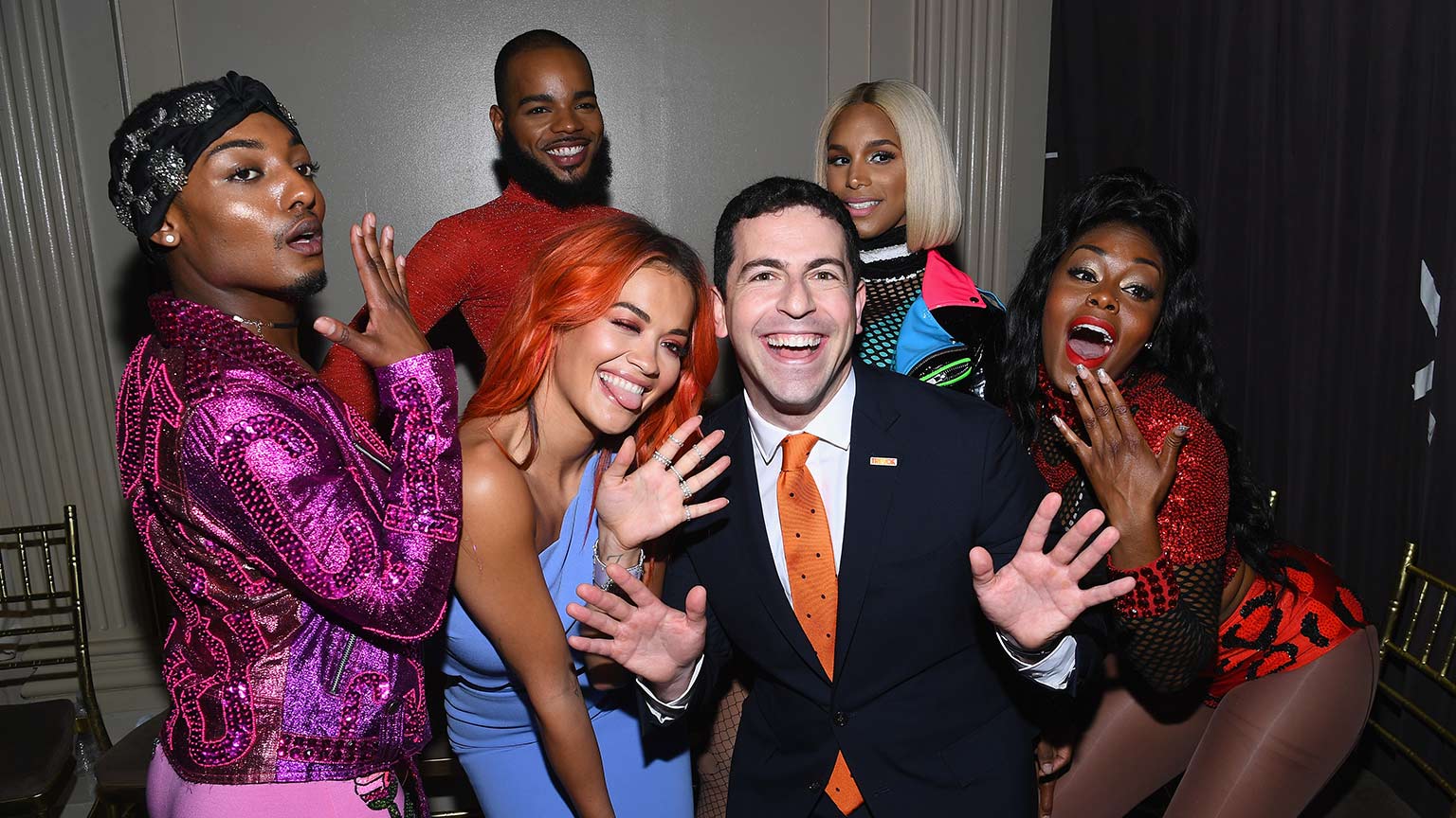 Photo of the Trevor Project CEO (and former McKinsey consultant) Amit Paley with singer Rita Ora and MTV’s Alex Mugler, Relish Milan, Tati 007, and Lolita Leopard at a 2018 event.