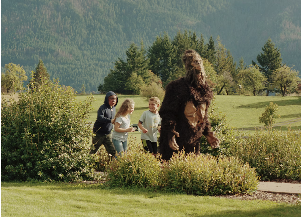 Children chase someone in a Bigfoot costume at the 2019 Bigfoot Bash in Home Valley, Washington.