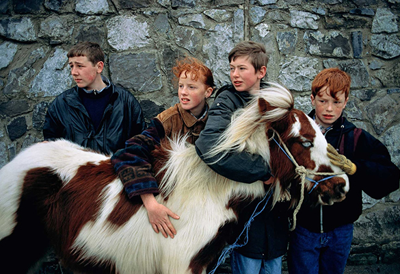 Lee Johnson, left, with his pony Gypsy in the Clondalkin district of Dublin. Says Abell of this photograph which made the cover of the September 1994 issue of National Geographic, "“They didn't know National Geographic-- clearly I was an American, I had a camera. And courteously, in a state of pure bewilderment, they stopped, stood behind their pony, and stared me down.