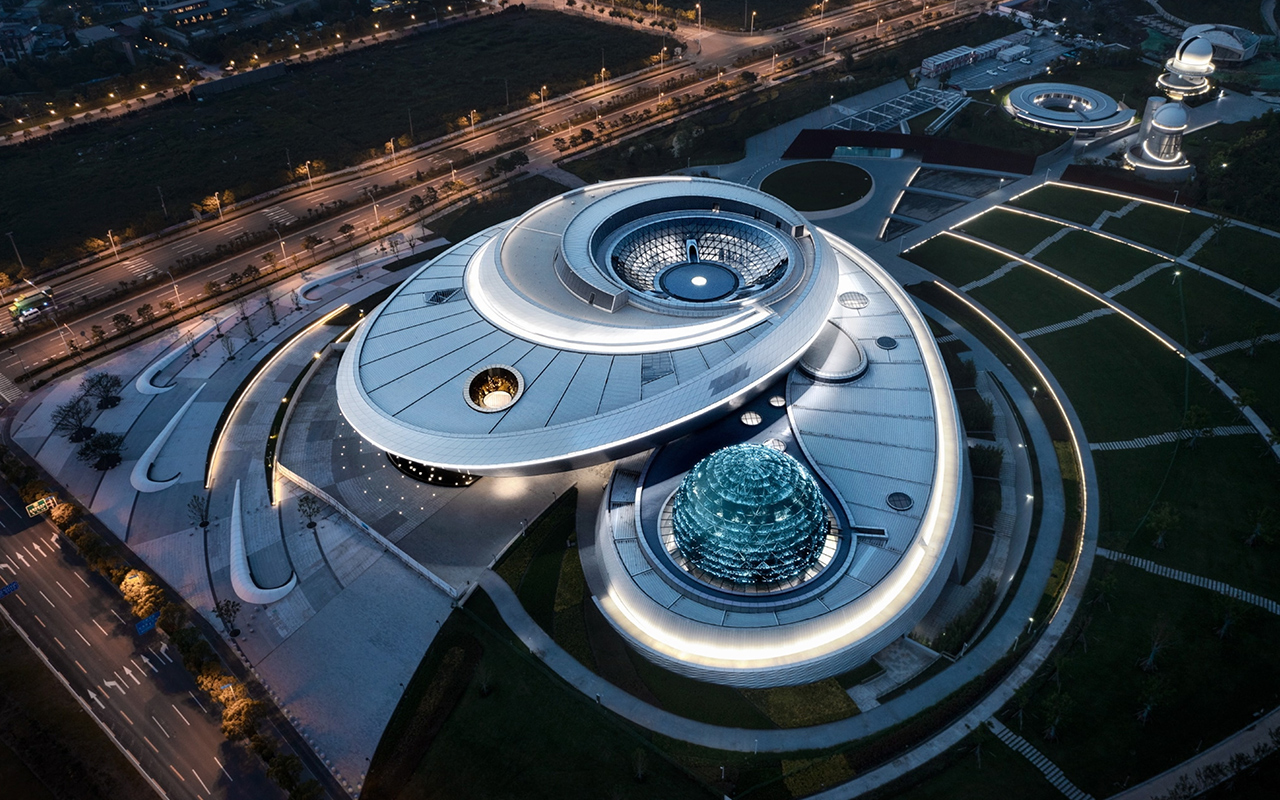 Rounded buildings meant to mimic the stars and planets make up the new Shanghai Museum of Astronomy by Thomas J. Wong and Ennead architecture.