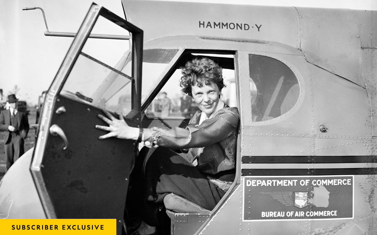 Amelia Earhart poses for a portrait in an airplane circa 1936.