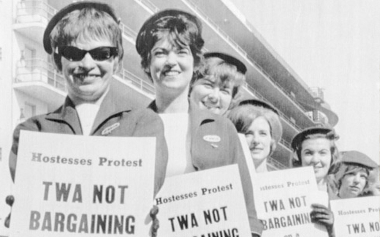 In an undated, mid-20th century photo, Trans World Airlines flight attendants picket for a pay raise.