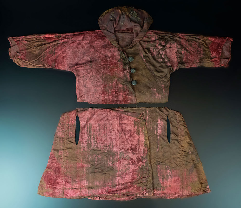 A picture of a weathered and old red tunic