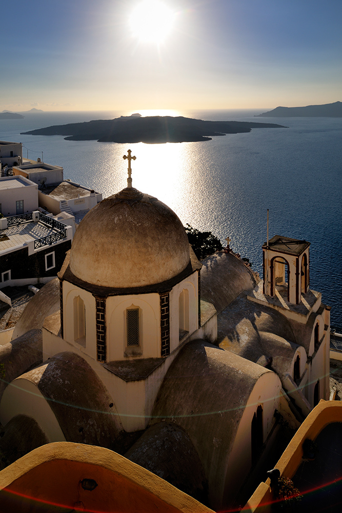 Agios loans church on the caldera rim in Fira, Santorini's capital. In the back is the island of Nea Kameni