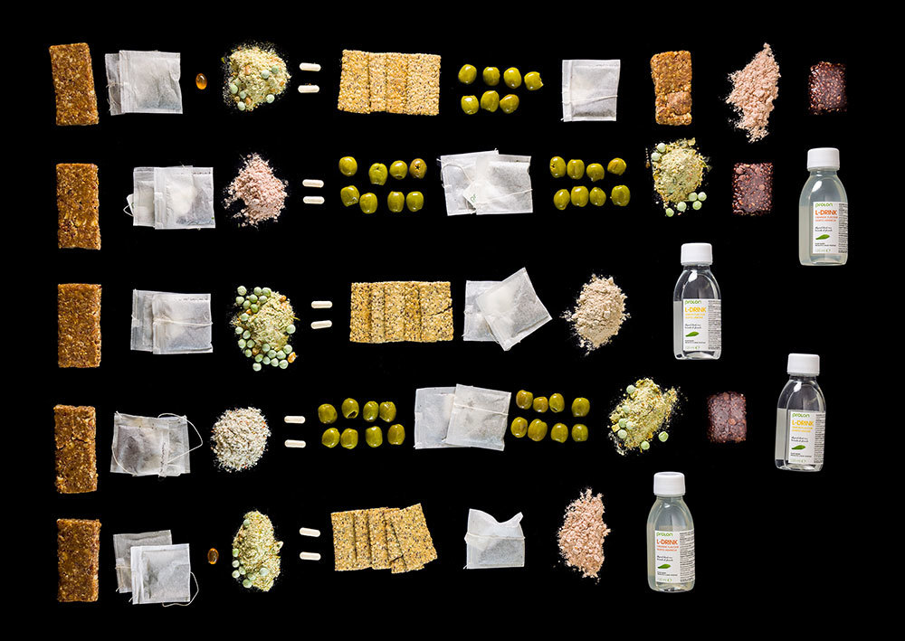 A picture of crackers, tea bags, and other items on a black background