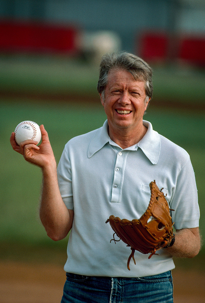 President Jimmy Carter holds a baseball