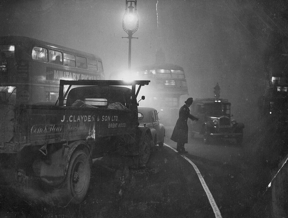 Outside the Bank of England, an officer keeps traffic moving through the Great Smog of London. The disaster highlighted the danger of Britain's reliance on burning coal as the city found itself strangled by a dense fog mixed with sulfuric acid.