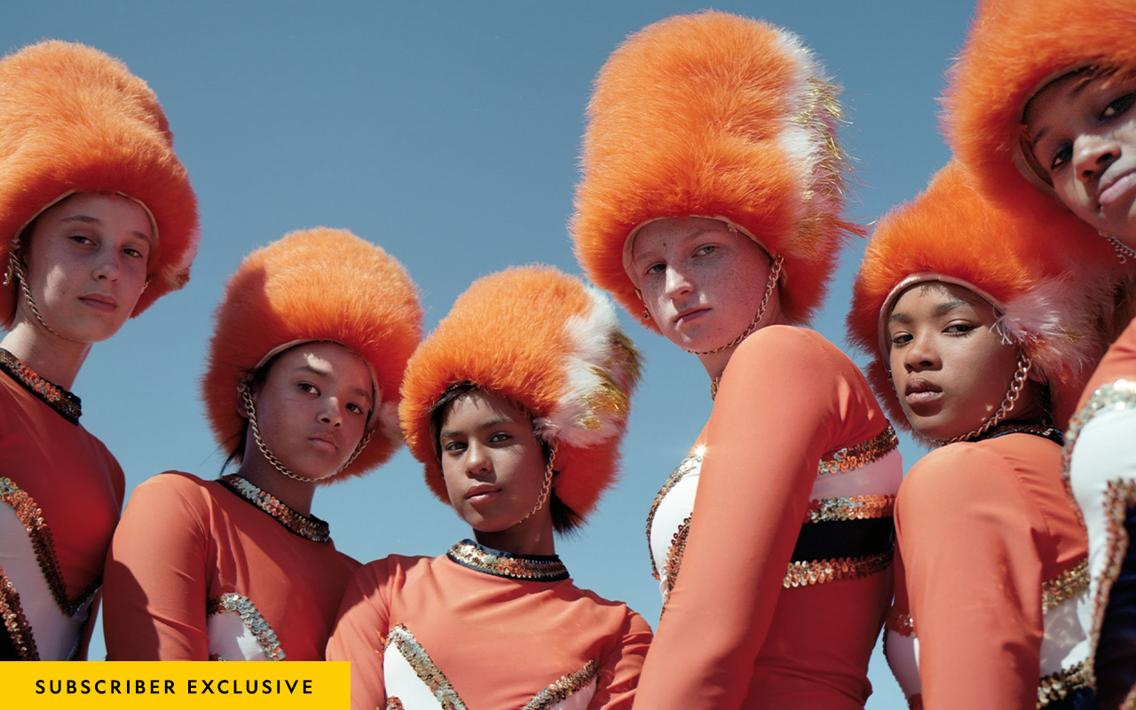 There are no days off for “drummies.” On a national holiday, the Fairmont High School Drum Majorettes gather to practice elaborate routines.