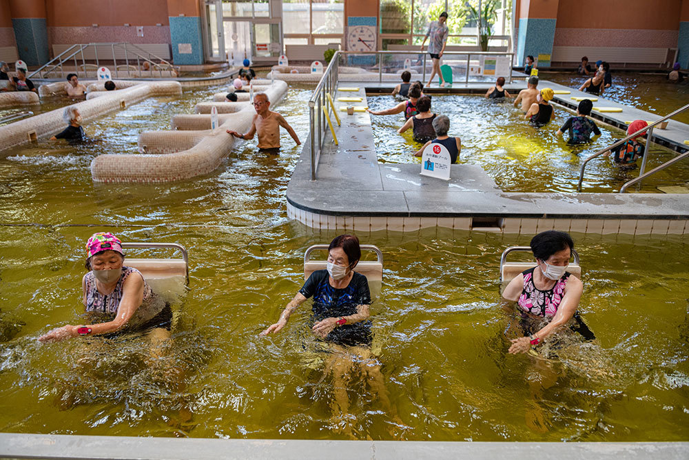 Exercisers in a pool fed by hot springs