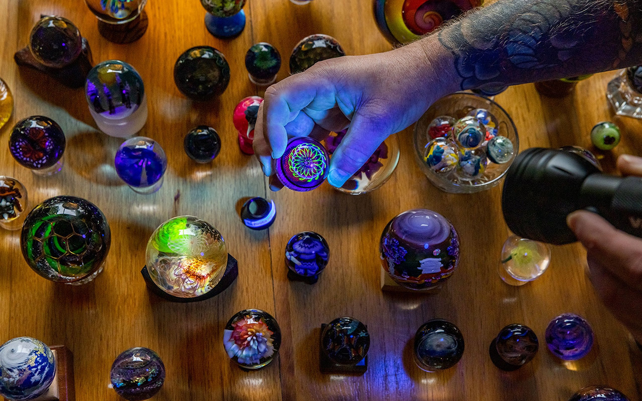 Shayne Sines holds one marble from his vast collection. He is among a growing group of marble hunters and collectors in Humboldt County, California who are taking part in a relatively new pastime that has attracted tens of thousands of people around the world.
