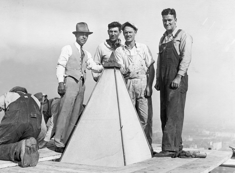 A picture of workers near the top of the Washington Monument.