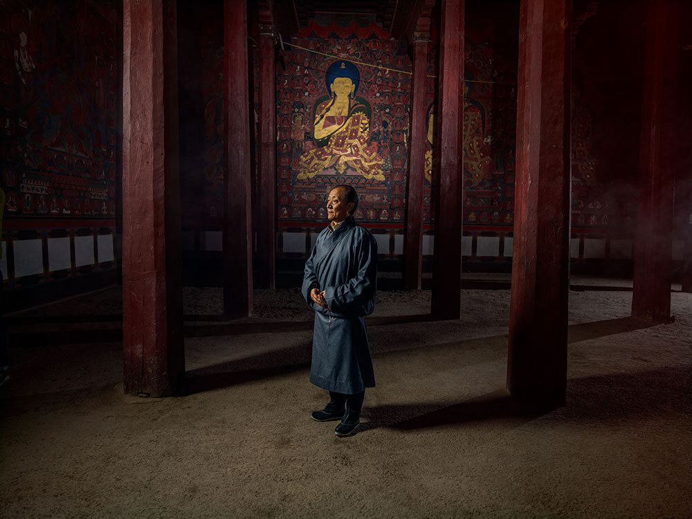 A picture of a man standing in a temple