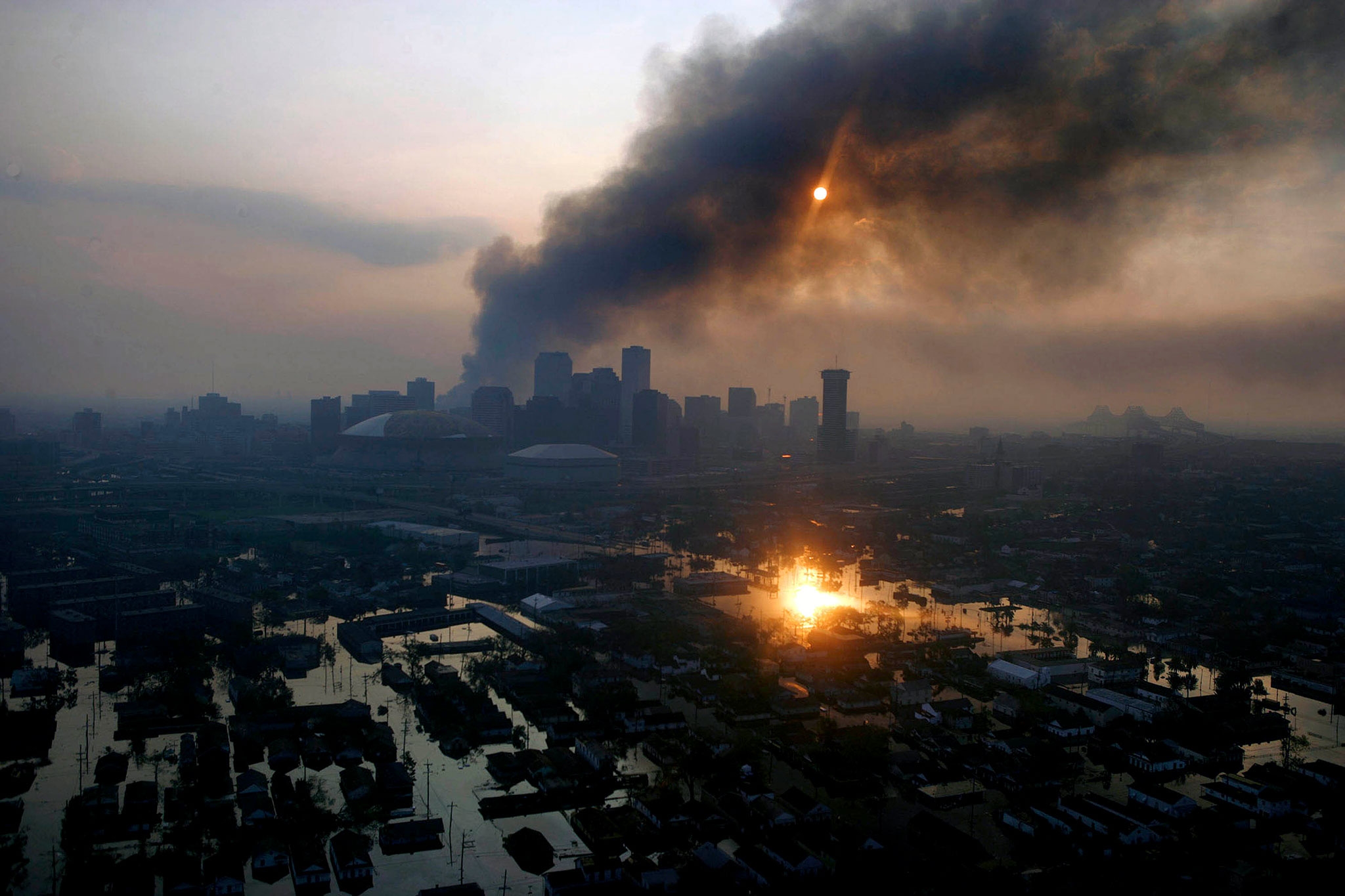 Fires burn in New Orleans in an apocalyptic scene after Hurricane Katrina pummeled the Gulf Coast