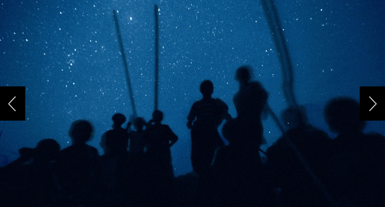 Children of nomadic Afar herders in northern Ethiopia gather in Herto Bouri, the Milky Way lighting the night sky. From here our ancestors began their spread across the planet.