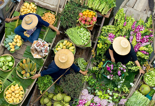 Vendors display their produce at a floating market in Bangkok, Thailand.