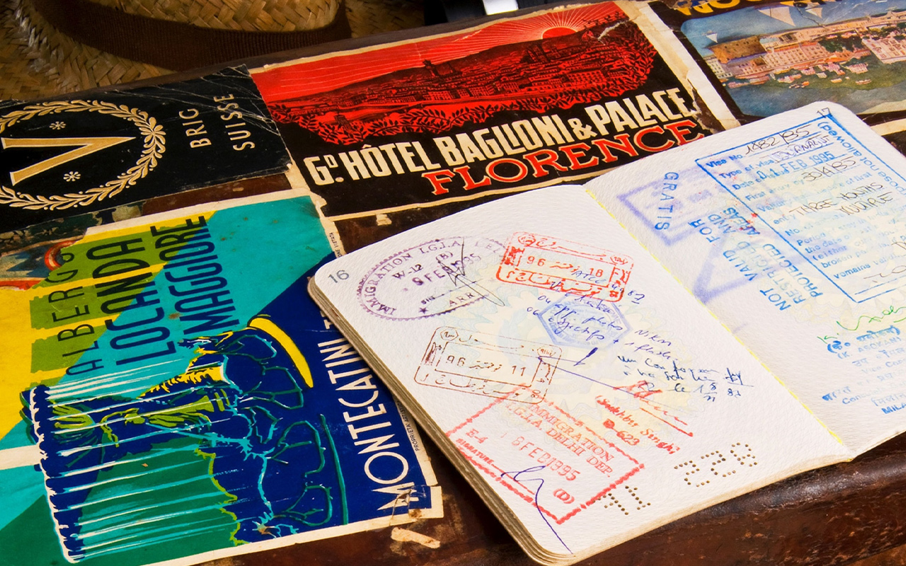 A photo of passports, visas, and other travel documents.