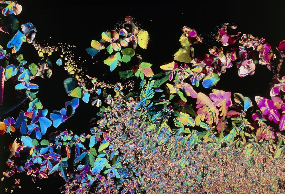 A multi-colored, kaleidoscope of crystalizes shapes ranging from small to micro sizes.