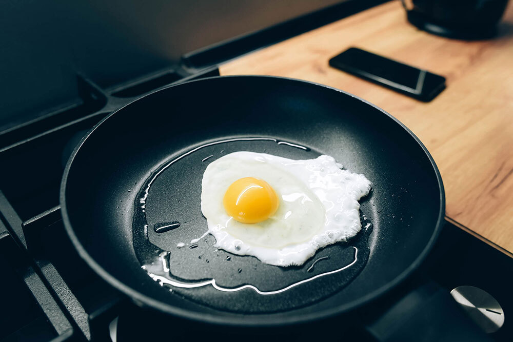 Fried egg in a nonstick black skillet