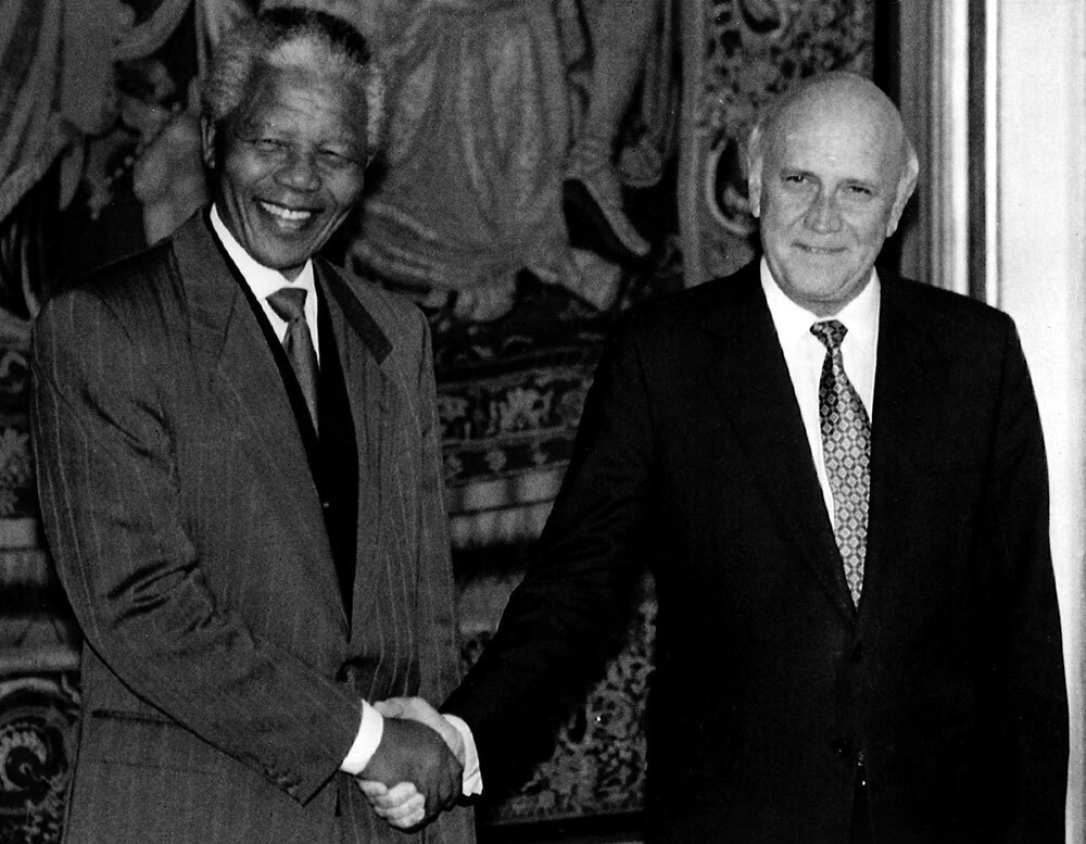 A photograph of Nelson Mandela shaking hands with the former president of South Africa