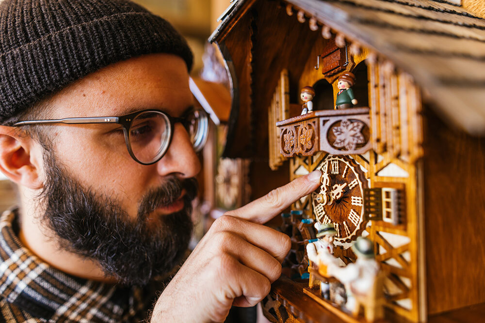 Setting an antique clock back in Germany.