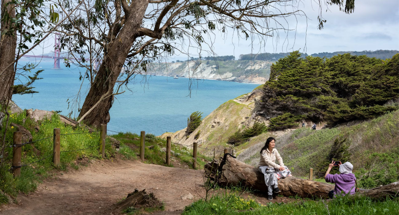 Two walkers on the Coastal Trail portion of a walk that crosses San Francisco.