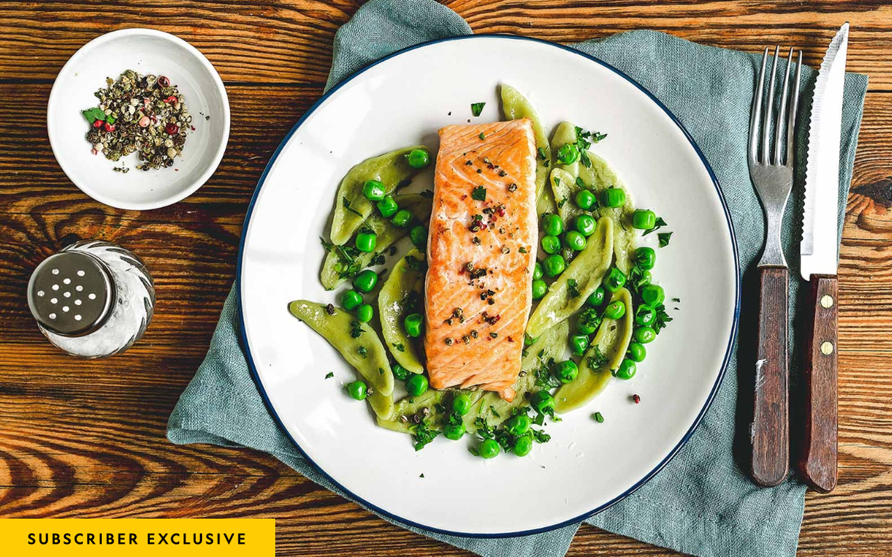 Plate of salmon with vibrant vegetables, a delicious and nutritious meal.