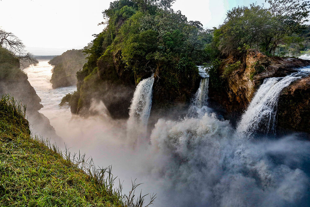 Three waterfalls plummet into a ravine