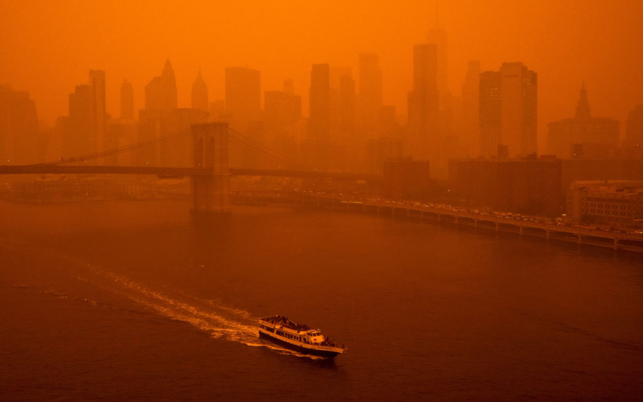 A lone ship travels on the East River in New York City on June 7, 2023.