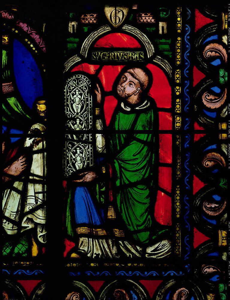 A detail from the Tree of Jesse stained glass window in St-Denis depicts Abbot Suger, who believed that this style of window would transform the earthly realm into a heavenly one filled with light.